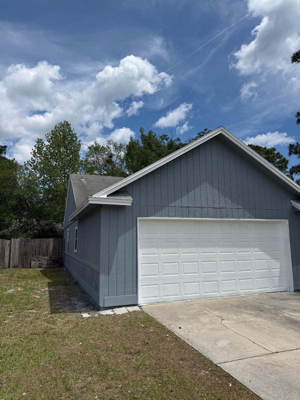 House exterior with new paint and garage door